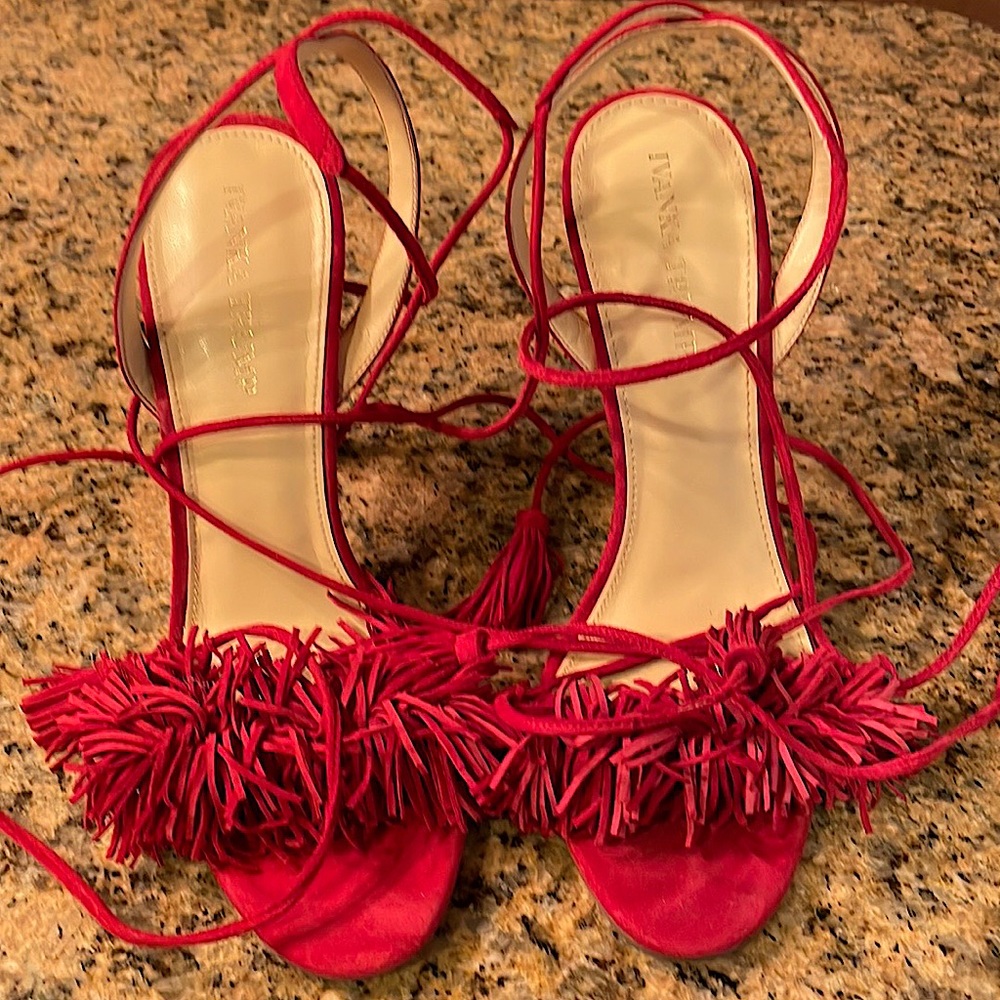 This is an Ivanka Trump 4 inch heel in fire engine red, in swede material.